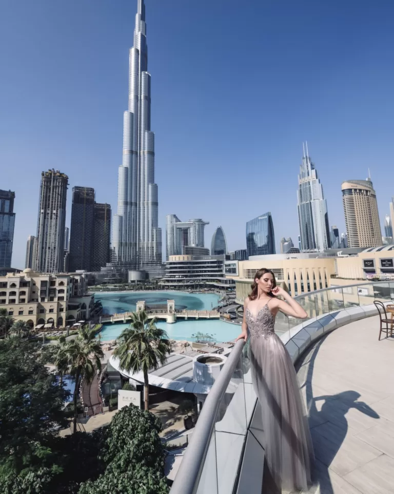 Female model in elegant dress with Burj Khalifa view — outdoor fashion photography in Dubai