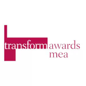 Tall photographer capturing cityscape with professional camera equipment.